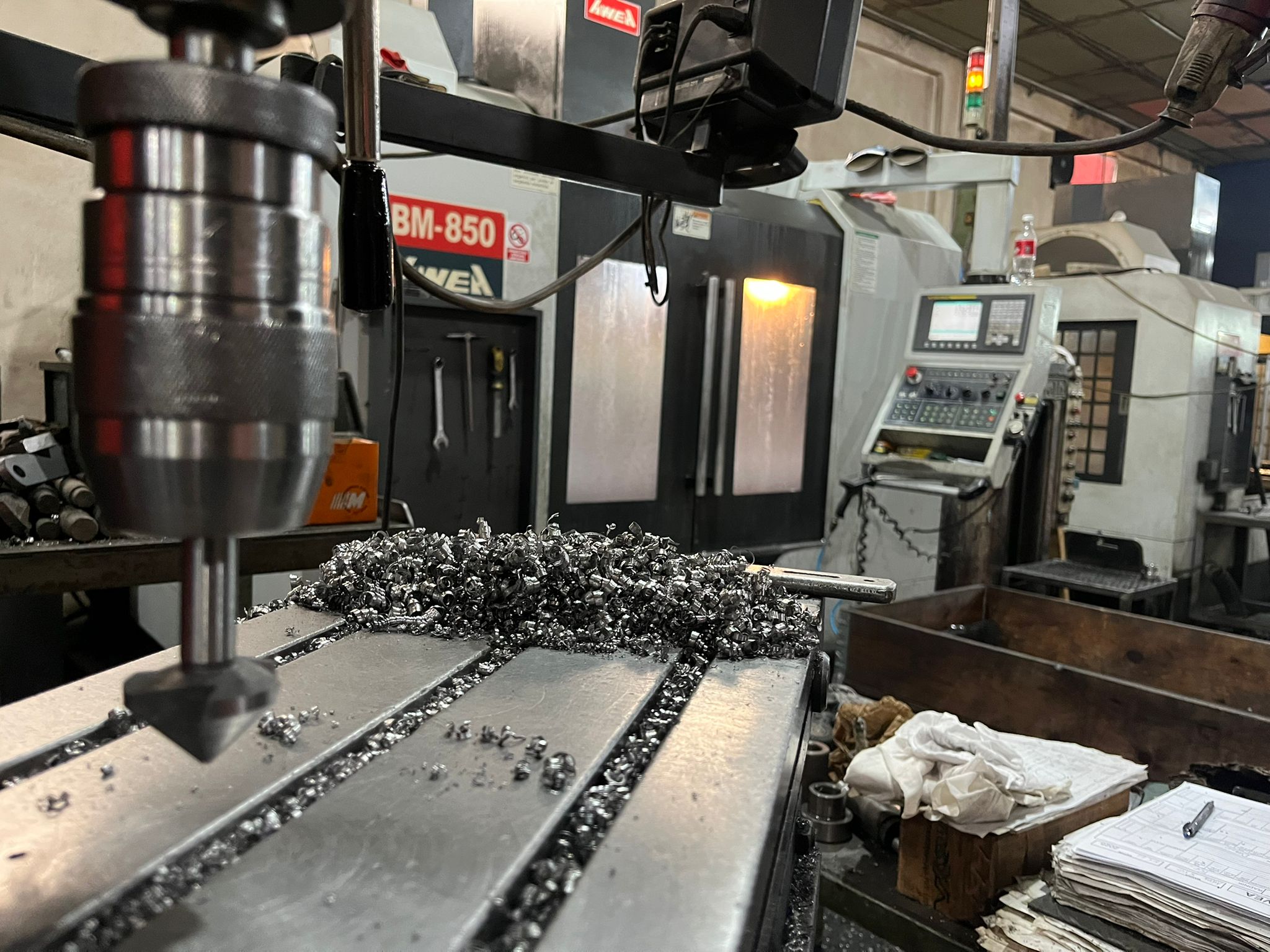 Drill press with metal swarf and BM-850 in background