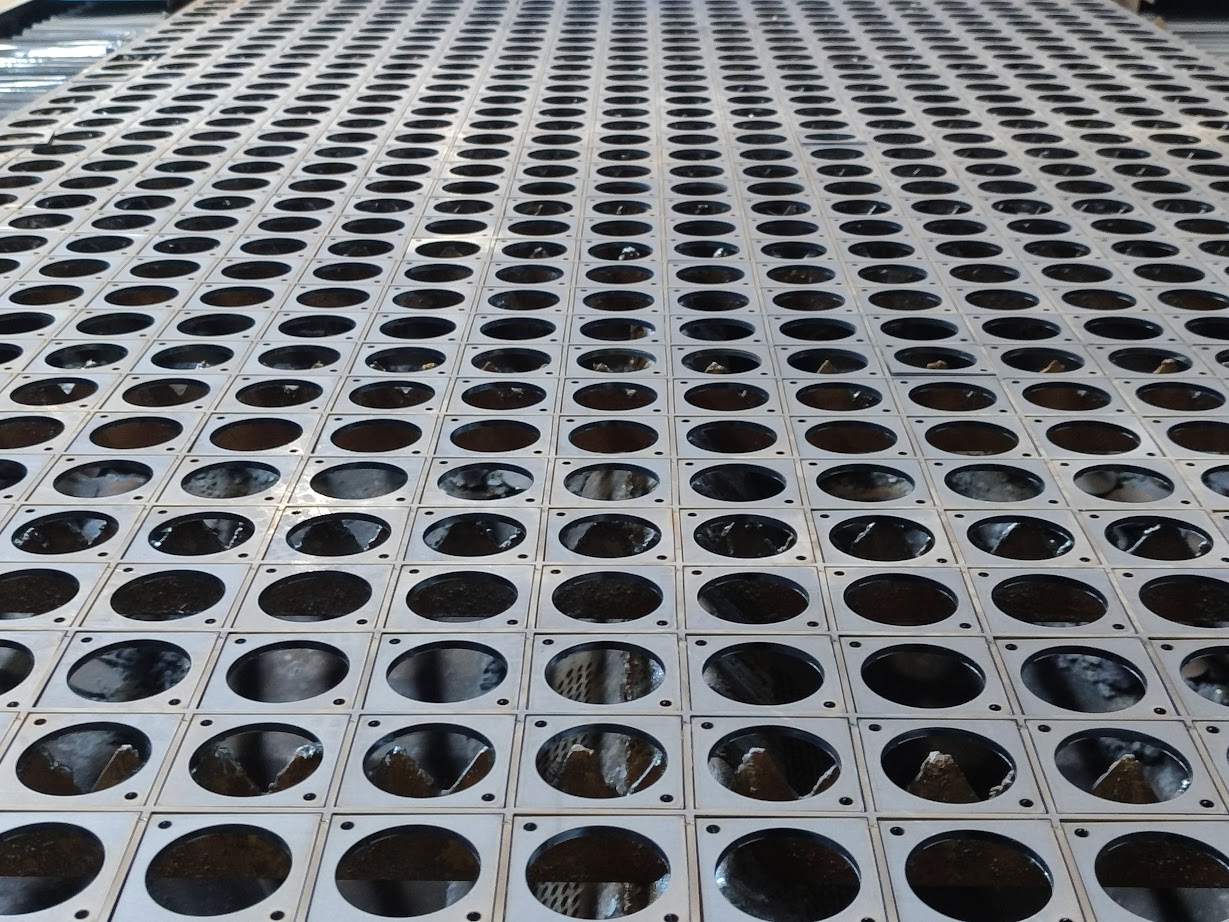 Laser-cut steel plates with circular contours
