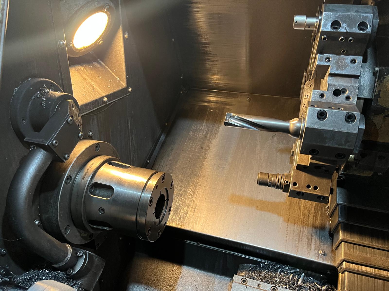 CNC lathe interior with drill tool